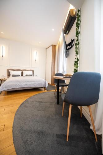 Ένα ή περισσότερα κρεβάτια σε δωμάτιο στο Central Belgrade Apartments