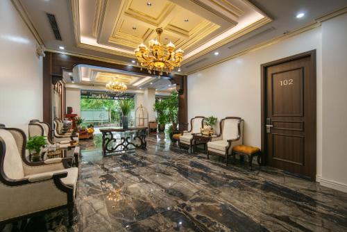 a lobby of a hotel with a chandelier at Royal Dương Nội Hotel in Hanoi