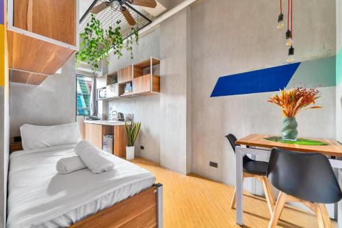 Ένα ή περισσότερα κρεβάτια σε δωμάτιο στο Redenza Suites Makati