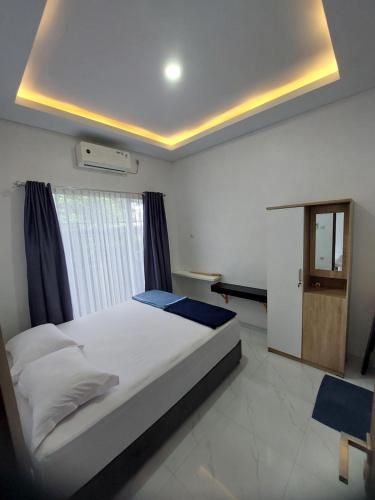 Ένα ή περισσότερα κρεβάτια σε δωμάτιο στο Cantiq Homestay
