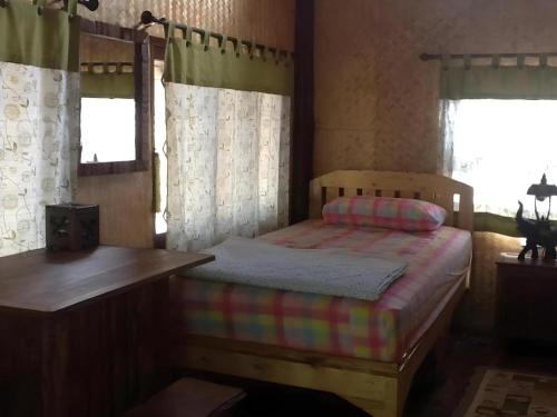 Postel nebo postele na pokoji v ubytování Chiang Dao Hut