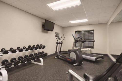 a gym with exercise equipment in a room at Country Inn & Suites by Radisson Raleigh-Durham Airport NC in Morrisville
