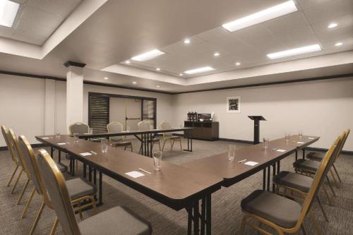a conference room with a long table and chairs at Country Inn & Suites by Radisson Raleigh-Durham Airport NC in Morrisville