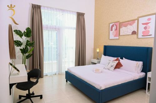 a bedroom with a blue bed and a window at Supernova Haven 1BR - Peaceful Poolside Getaway Near Yas Mall & Marina in Abu Dhabi