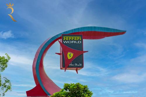 a kite is flying in the sky at Supernova Haven 1BR - Peaceful Poolside Getaway Near Yas Mall & Marina in Abu Dhabi