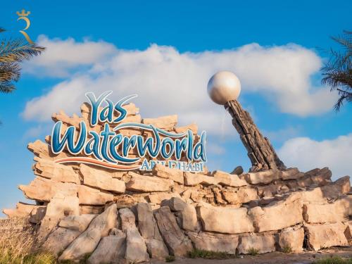 a sign for the walt disney world attraction at Supernova Haven 1BR - Peaceful Poolside Getaway Near Yas Mall & Marina in Abu Dhabi