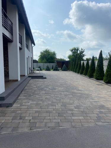 a patio with a bench on the side of a building at вулиця 8-го Березня Апартаменты in Myrhorod