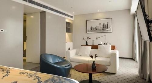 Area soggiorno di Shanghai Bund South China Harbour View Hotel
