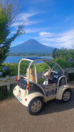 a golf cart with a view of a mountain at Fuji Dome Glamping in Fujikawaguchiko