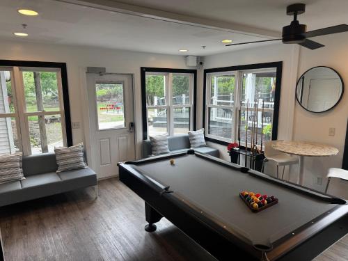 a living room with a pool table and chairs at Blue Star Motel in Douglas