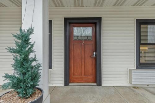 a wooden door on a house with a christmas tree at Blue Star Motel in Douglas