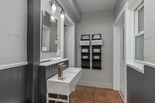 a bathroom with a white sink and a mirror at Blue Star Motel in Douglas