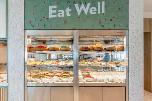 a bakery with a display case filled with pastries at EVEN Hotel Guangzhou Baiyun Station by IHG - Free Shuttle Bus to Canton Fair Complex During Canton Fair Period in Guangzhou