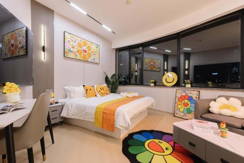a bedroom with a bed and a desk and a dining room at The Bund River Prologue Residence in Shanghai