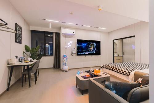 a hotel room with a bed and a living room at The Bund River Prologue Residence in Shanghai