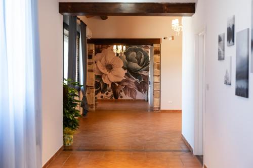 a hallway in a house with a painting on the wall at Tenuta Madre Vita in Siracusa