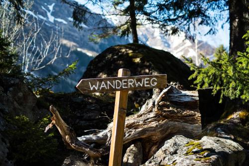 a sign that says wandering on top of a mountain at Gschlössl, Ferienhaus in Rauris