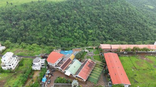 an aerial view of a resort in the middle of a forest at Relax Adventure Resort in Igatpuri