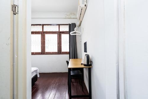 Postel nebo postele na pokoji v ubytování GO INN Siriraj BKK - โกอินน์ โรงพยาบาล ศิริราช
