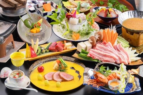 a table with many plates of food on it at Kiyonoya in Asakura