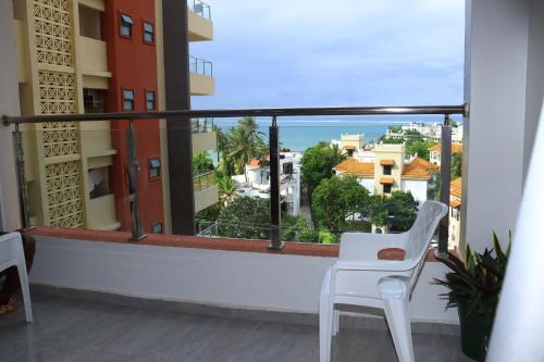 a balcony with a view of the ocean at Luxurious apartments Mombasa in Mombasa