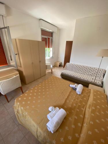 a bedroom with two beds with towels on it at L'Ostello in Vasto