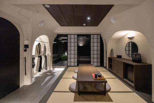 a dressing room with a table and a bench at Cave Ryokan Hotel by Aank Sungshin Women's University in Seoul