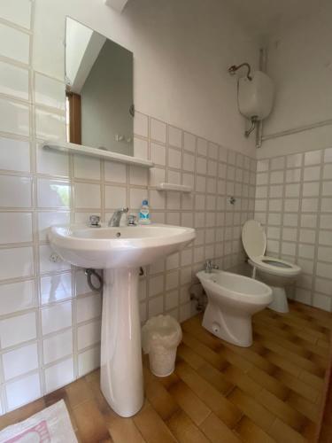 a bathroom with a sink and a toilet at L'Ostello in Vasto