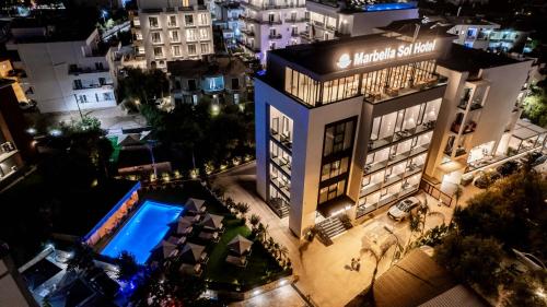 an aerial view of a building with a swimming pool at Marbella Sol Hotel - Only Adults in Ksamil
