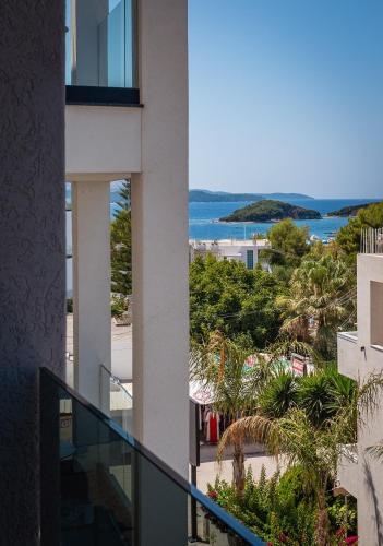 a view of the ocean from a balcony of a building at Marbella Sol Hotel - Only Adults in Ksamil