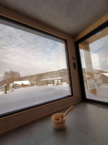a room with a large window with a view at Pod Gwiazdami in Cisna