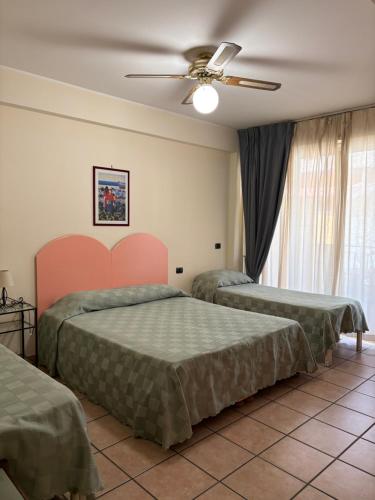 Postel nebo postele na pokoji v ubytování La Grotta