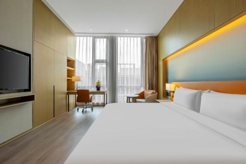 Postel nebo postele na pokoji v ubytování Steigenberger Hongqiao Shanghai
