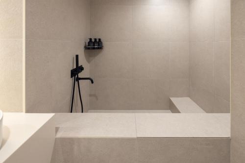 a bathroom with a bath tub with a camera at Cave Ryokan Hotel by Aank Sungshin Women's University in Seoul