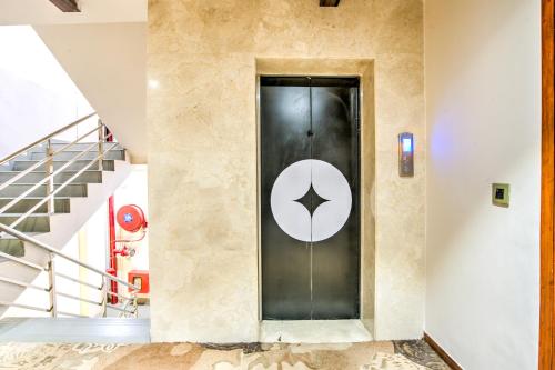 a door with a star on it in a building at Clubhouse Hotel Ayodhya in Ayodhya