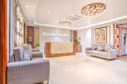 a lobby with couches and a counter in a store at Clubhouse Hotel Ayodhya in Ayodhya