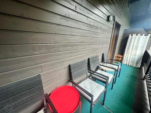 a row of chairs in a room with a wall at Hanna's Home in Kitzbühel