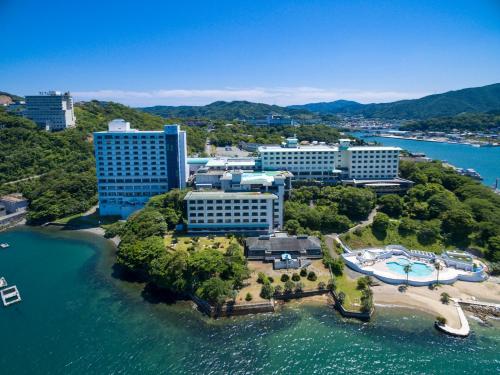 an aerial view of a resort on a island in the water at Toba Seaside Hotel in Toba