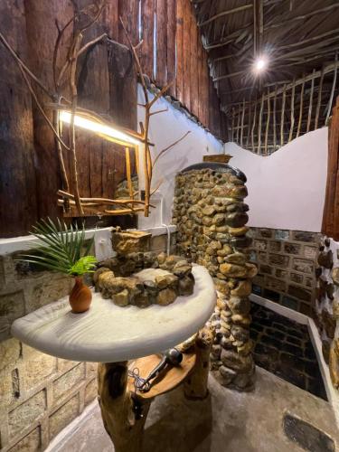 a bathroom with a stone table in a room at Ella Soul Nest Glamping Tent for Nature Lovers in Ella