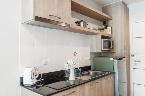Η κουζίνα ή μικρή κουζίνα στο Apartments at The Bliss Condo by Lofty