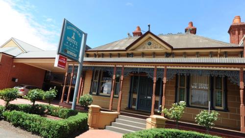 an old house with a sign in front of it at Alexandra Place in Bendigo
