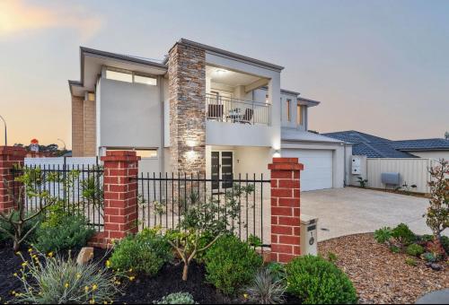 an image of a house with a fence at Spacious Stay near Karrinyup in Perth