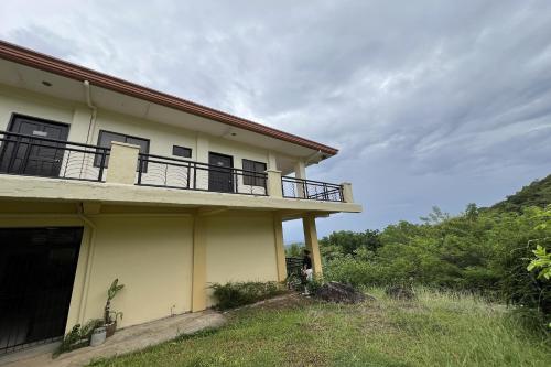 a house with a balcony on the side of it at Vista Venice Resort in Morong