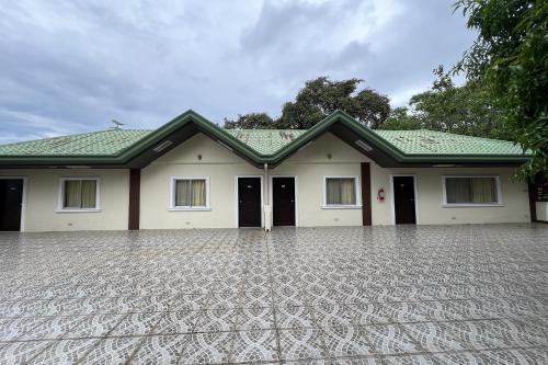 a house with a driveway in front of it at Vista Venice Resort in Morong