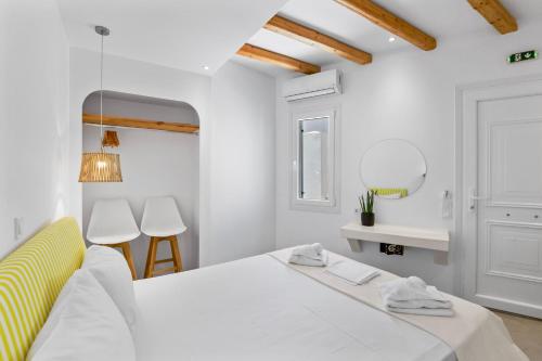 Letto o letti in una camera di Ammoudi