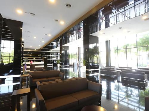 a lobby with couches and chairs in a building at Seeds Hotel Premier One City Subang Previously eCity Hotel One City in Subang Jaya