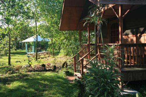a house with a garden in front of it at Kirpal Meditation and Ecological Center in Pahoa