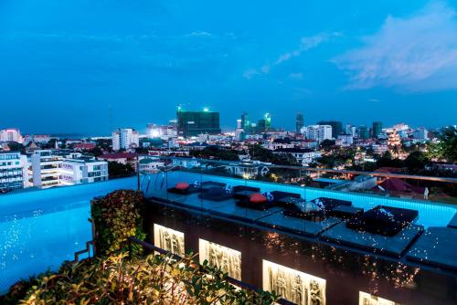 a view of a city skyline at night at Aquarius Hotel and Urban Resort in Phnom Penh