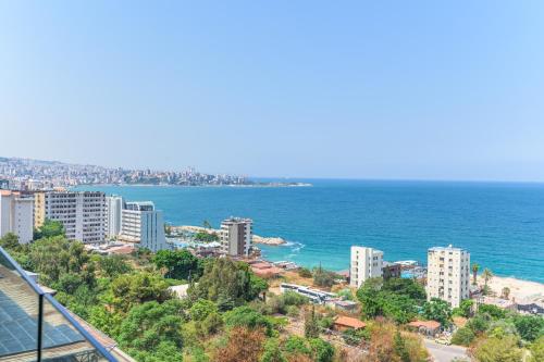 a view of a city and the ocean at Jounieh Living - Residences by Local Host in Ed Dkârîne