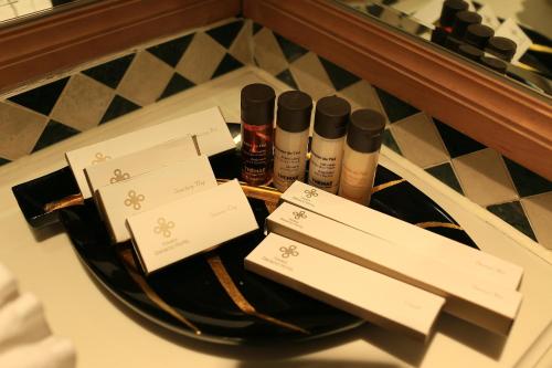 a group of bottles of cosmetics sitting on a counter at Hanoi Daewoo Hotel in Hanoi